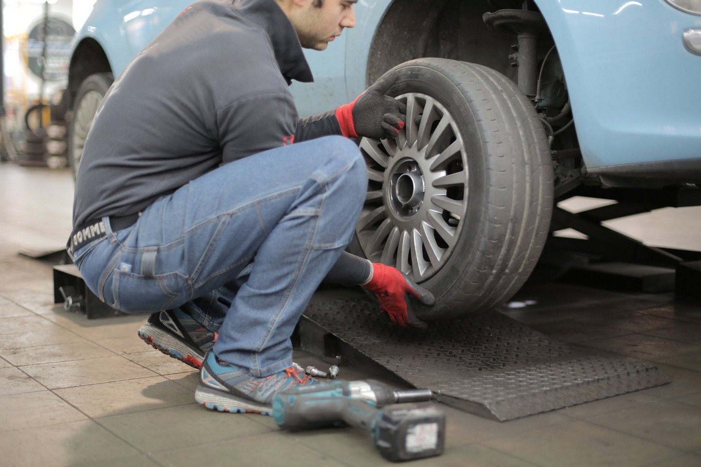 mechanic fixing a tire